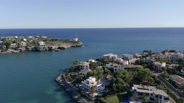 Portocolom with lighthouse and blue sea, Mallorca, Spain