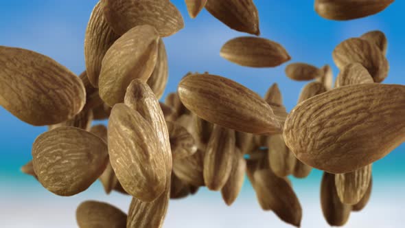 Flying of Almonds in Sky Background