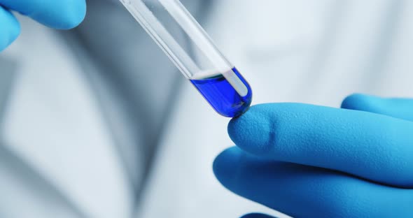 Close-up Shot with Hitting Laboratory Equipment. alt