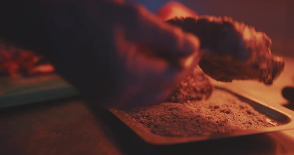 Hands of professional chef preparing meat for cooking