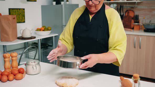 Adding Flour in Metallic Sieve