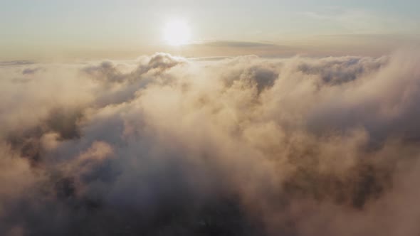 View From a Drone of City Center Above Which Clouds are Rapidly Floating