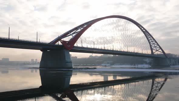 Novosibirsk Bugrinsky Bridge in Winter Against the Backdrop of the Back Sun