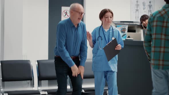 Busy Hospital Reception Desk with Different People Having Appointment