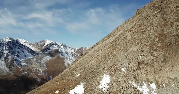 A Group of Tourists Stands on the Mountainside