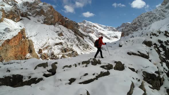 Tourist Hiker With Backpack Climbing