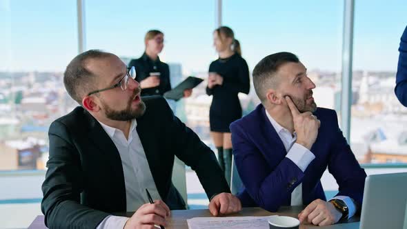Businesspeople interacting at meeting in conference room at office