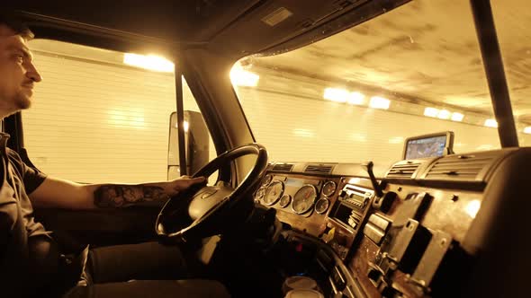 Truck Driver Rides Trough Tunnel Warm Yellow Light