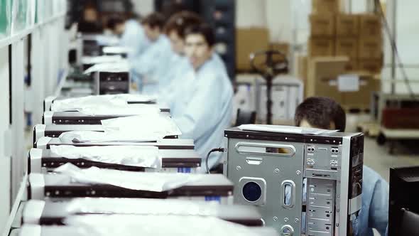 Assembly Line Workers in a Computer Factory.