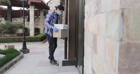 Man Contactless Delivers Parcel at Home Doorstep Knocks on Doors and Come Away