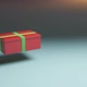 Gift in red box with green ribbon floating in the air. New year and Christmas present. - VideoHive Item for Sale