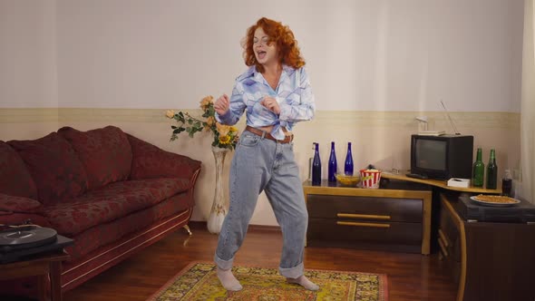 Joyful Dance of Happy Retro Woman Indoors at Home in Slow Motion