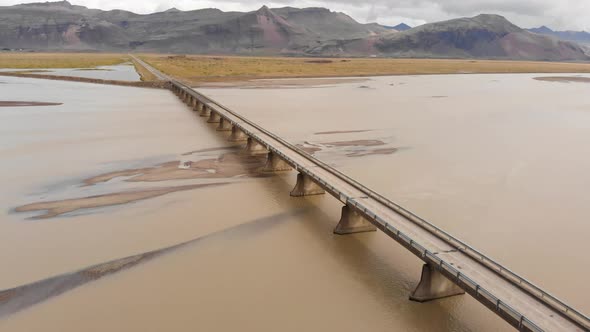 one way bridge over a large glacier river