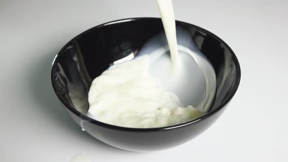 Pouring Milk Into Bowl