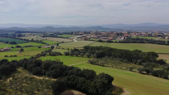 Drone shot of Catalan natural splendor in full glory with a lovely Ullastret cityscape.