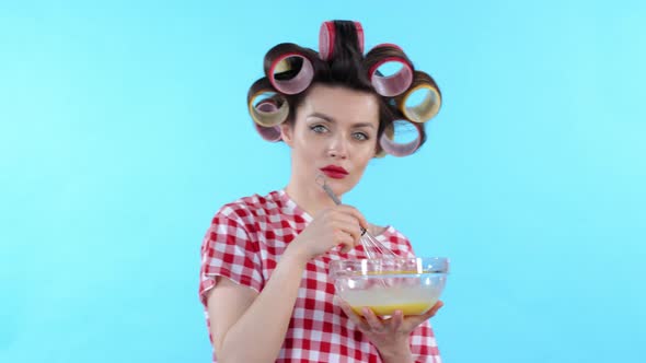 Portrait of Woman Curling Hair and Cooking