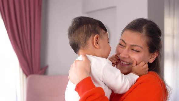 Baby loving his mother.