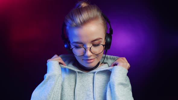 Hipster Stylish Lady Deejay in Headphones Enjoying Music Sound