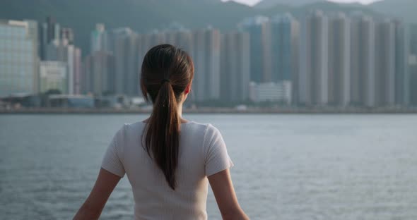 Woman Look Around in The City and Standing at The Seaside