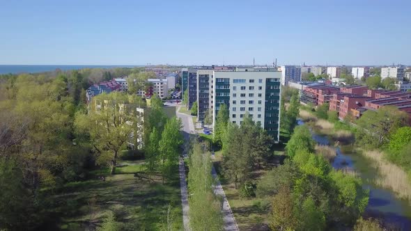 Aerial view of crowded residential district apartment buildings on a sunny summer day, renovated and