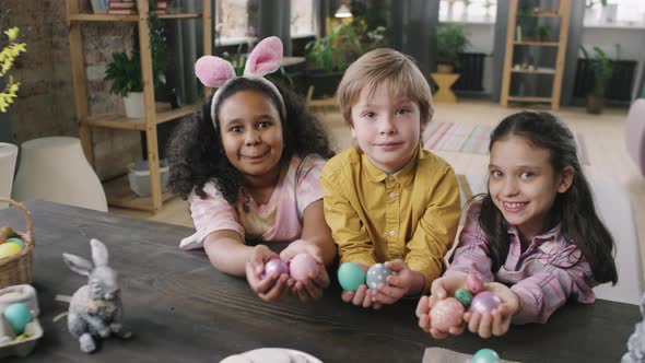 Portrait of Happy Kids with Easter Eggs