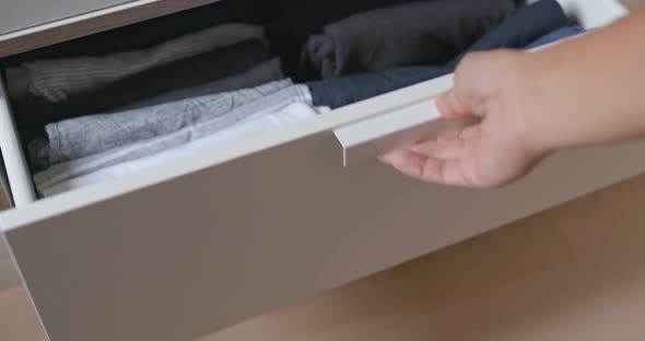 Open the Drawer with Clothes