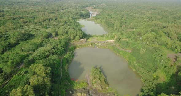 Aerial flyover big river that contain small amount of water with tree vegetation in Indonesia,Asia