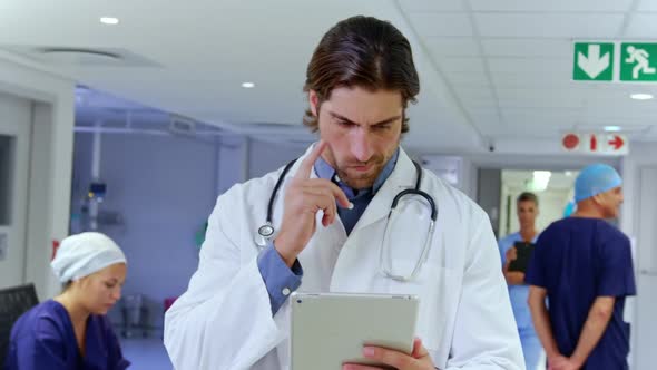 Male doctor using digital tablet in the hospital 4k