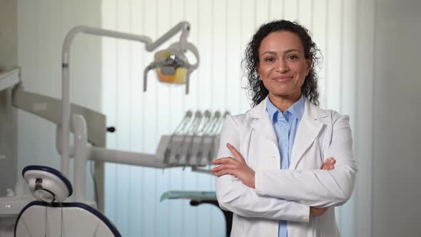Portrait of Woman Dentist Posing in Dental Office