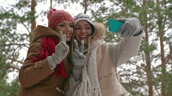 Happy Women Taking Picture at Winter Vacation