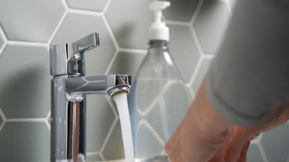 Close Up of Woman Washing Hands with Liquid Soap