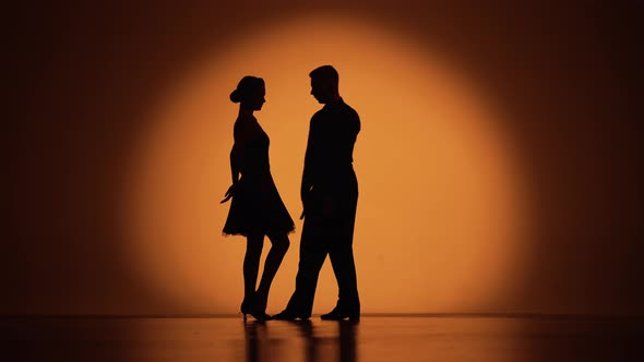 Couple of Dancers Approach Each Other and Begin to Dance Argentine Tango