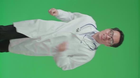 The Front View Of Asian Doctor With Stethoscope Running On Green Screen Chroma Key