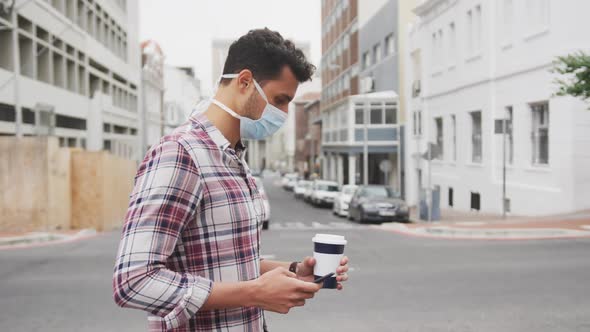 Side view of Caucasian man on the go wearing a coronavirus Covid19 mask