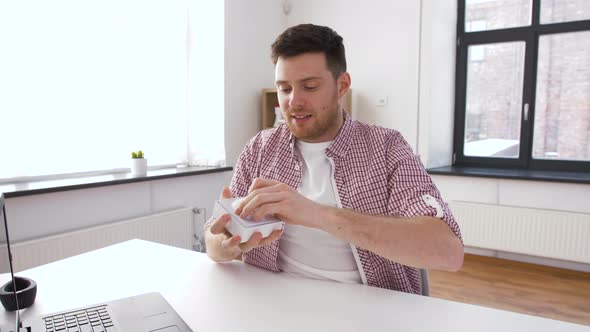 Male Blogger with Earphones Videoblogging at Home 42