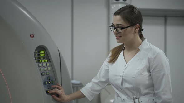 Female Patient On The Ct Or Mri Scanner Machine During X-Ray Process