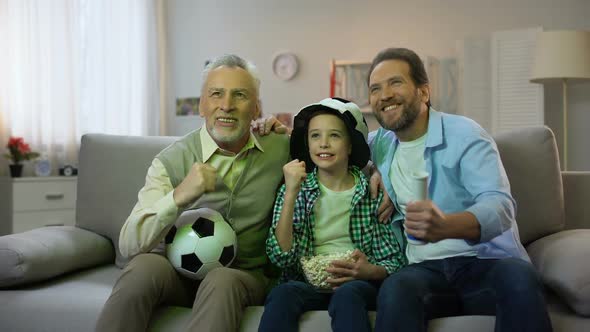 Excited Grandpa, Dad and Son Happy for National Football Team Winning Game, Home