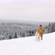Man Walking With His Happy Dog In Snow - VideoHive Item for Sale