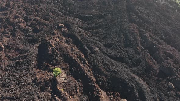 Drone Aerial of the Peak of a Volcanic Mountain in a National Nature Park Rocky Rough Beautiful