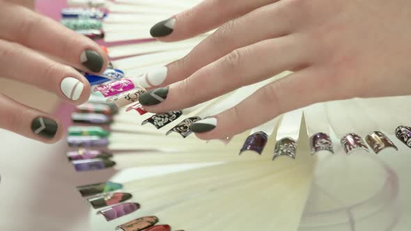 Female Hands and Wheel of Nail Art.