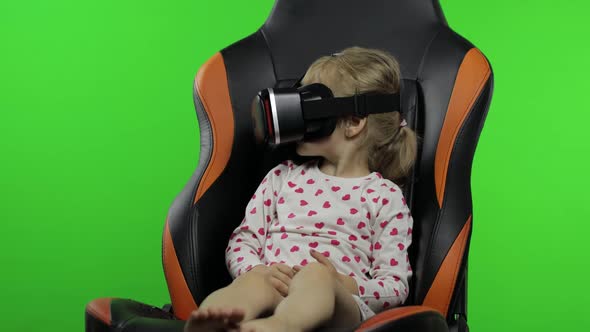 Child Girl Using VR Helmet To Play Simulation Game App. Watch Virtual Reality 3d Video. Chroma Key
