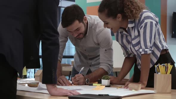 Creative Business People Group Having Conversation at Office Desk in Workplace