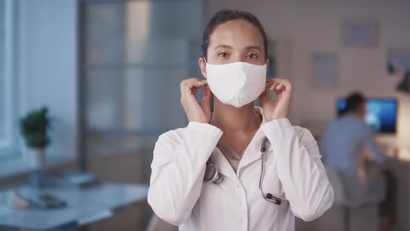 Woman Taking Mask Off