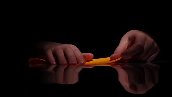 Origami of Yellow Paper. Black. Closeup