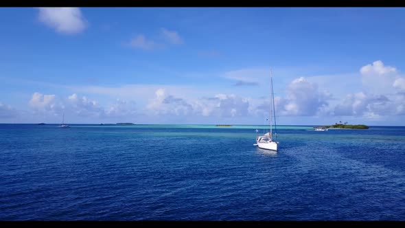 Aerial top view scenery of exotic island beach trip by shallow ocean with white sandy background of 