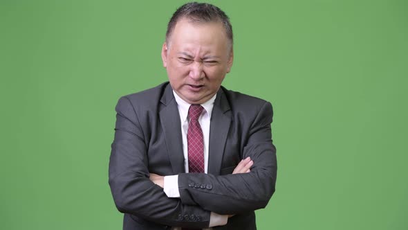 Mature Japanese Businessman Looking Angry