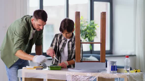 Father and Son Painting Old Table in Grey Color