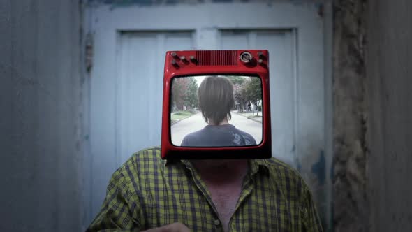 TV headed Man standing with a Young Man walking on the Screen.