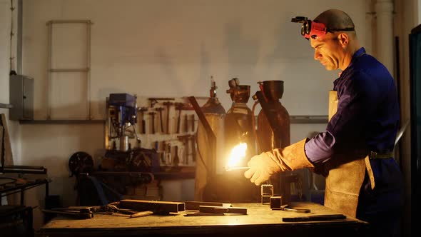 Welder welding a metal