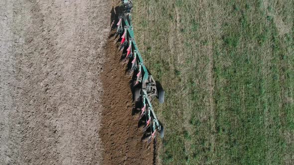 Countryside and Agriculture Grain Sowing Farm Tractors Plow the Earth in Field View From Height